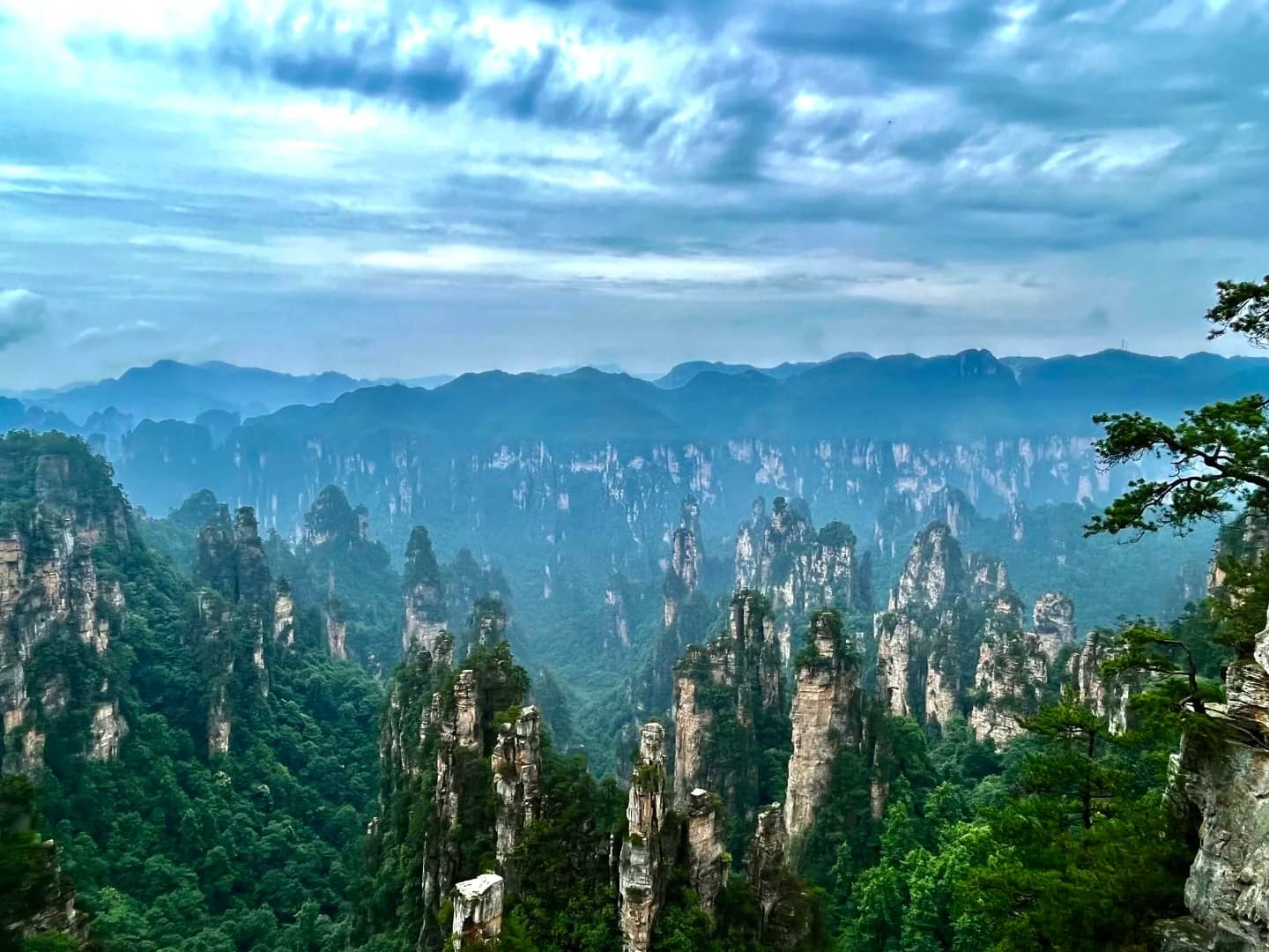 Zhangjiajie forest pillars in mist for a Beijing Xi’an Zhangjiajie Shanghai route