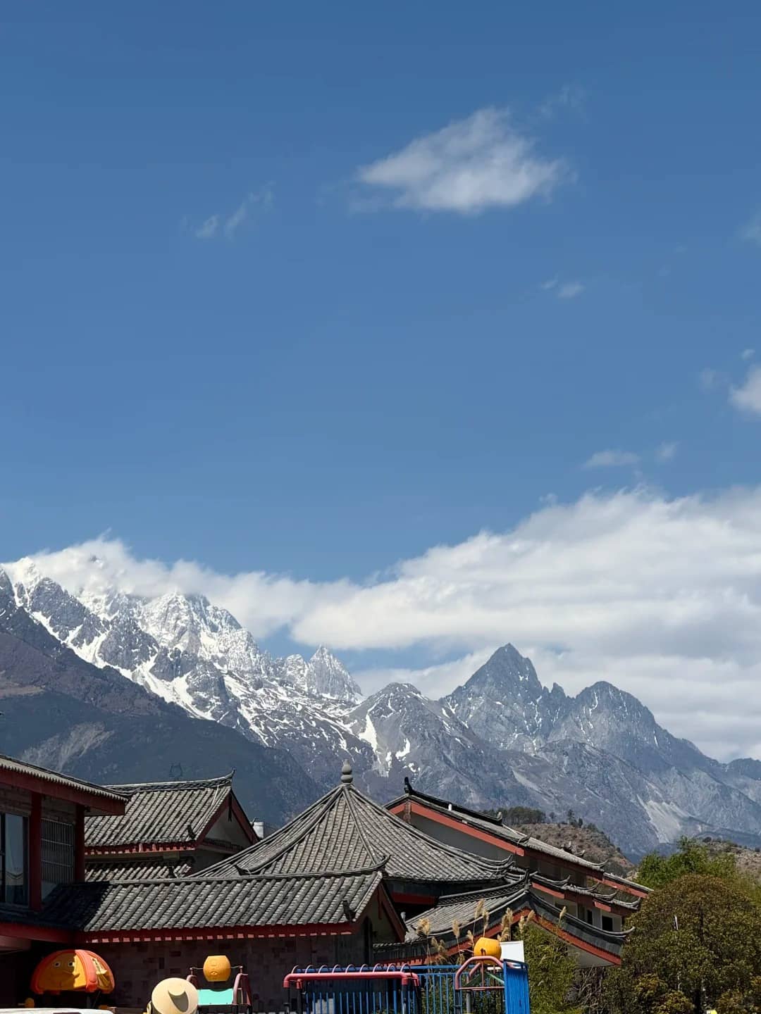 Shuhe rooftops and snow mountain route photo