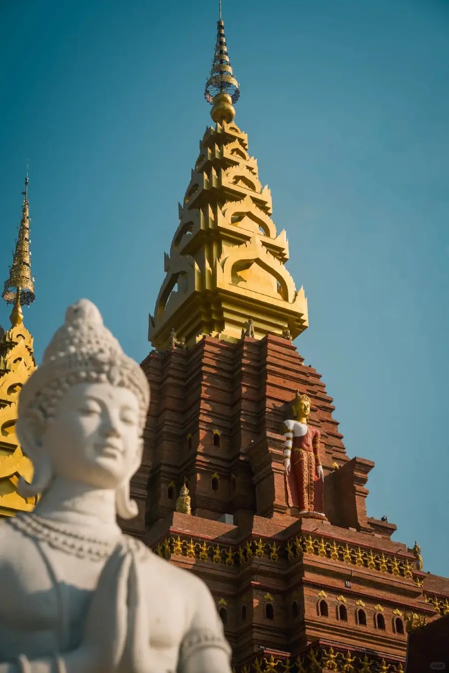 Dai-style temple architecture in Jinghong for a Kunming and Xishuangbanna route